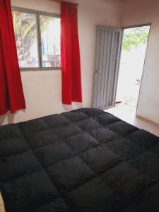 En eller flere senge i et værelse på Casa de Campo El cerrito