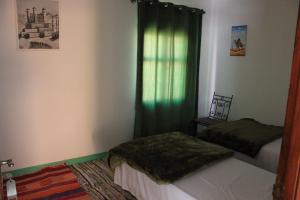 Voodi või voodid majutusasutuse Kasbah lucas toas