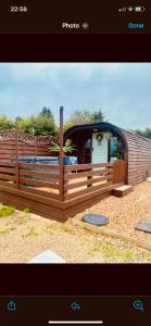 a picture of a wooden fence with a house at Crabmill glamping bewdley in Bewdley