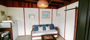 a room with a bed with blue pillows on it at Casa Dada in La Paloma