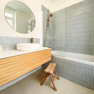 a bathroom with a sink and a mirror and a tub at La Source - Villa wissantaise in Wissant +19 photos