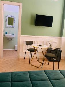 TV a/nebo společenská místnost v ubytování Hotel Melydà