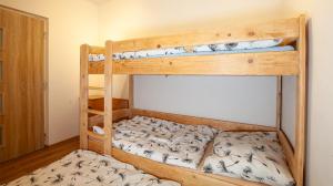Posteľ alebo postele v izbe v ubytovaní Apartmán ACTIVE