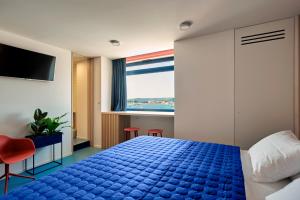 Posteľ alebo postele v izbe v ubytovaní Horizon Luxury Suites & Design Rooms