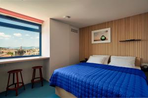 Posteľ alebo postele v izbe v ubytovaní Horizon Luxury Suites & Design Rooms