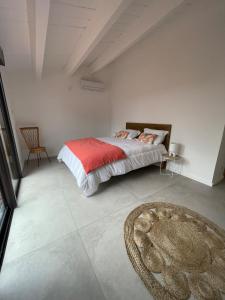 a bedroom with a bed and a rug on the floor at Villa Casa di sognu in Lecci