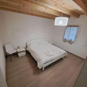 Postel nebo postele na pokoji v ubytování Sogno delle Dolomiti