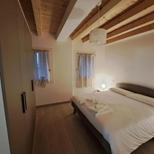 Postel nebo postele na pokoji v ubytování Sogno delle Dolomiti