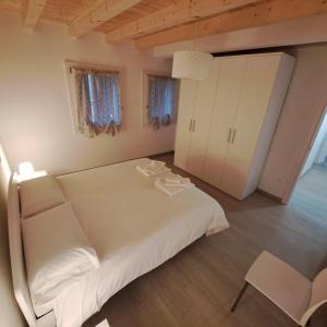 Postel nebo postele na pokoji v ubytování Sogno delle Dolomiti