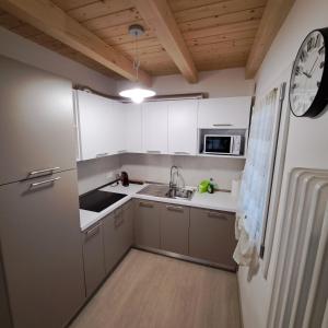 Kuchyň nebo kuchyňský kout v ubytování Sogno delle Dolomiti