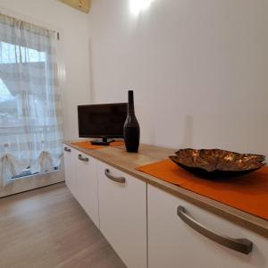 TV a/nebo společenská místnost v ubytování Sogno delle Dolomiti