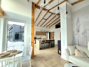 a living room with a couch and a table at Hunsrücker Tiny Ferien L in Hottenbach