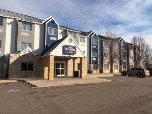 a building with a sign on the front of it at Microtel Inn & Suites by Wyndham Denver Airport in Denver