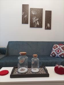 two glass jars on a tray on a coffee table at Pepper House Edessa in Edessa