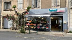 a store front of a store with a sign in front at Modern apartment large terrace and beautiful view in Quarante