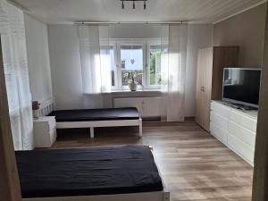 TV a/nebo společenská místnost v ubytování Monteurwohnung