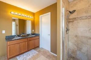 a bathroom with a shower and a sink and a mirror at Flagstaff Family Retreat in Flagstaff +44 photos