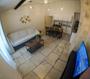 an aerial view of a living room and a kitchen at NEW! Wifi, Netflix Le Refuge des Berges in Beaucaire +16 photos