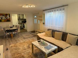 a living room with a couch and a table at Apartment Malti in Laufenburg