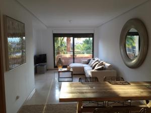 a living room with a couch and a table at Apartment Perfect Holiday in Jávea