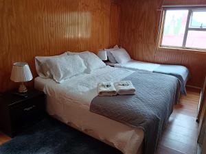 Postel nebo postele na pokoji v ubytování Hostal Reymar