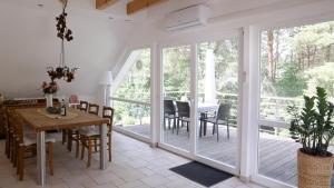 a kitchen and dining room with a table and chairs at Ferienwohnung Bestensee in Bestensee