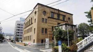 an old brick building on the side of a street at Guest House Hana in Otsu