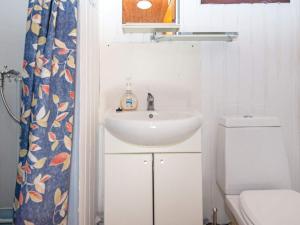 a bathroom with a sink and a toilet at 6 person holiday home in Ørsted-By Traum in Ørsted +42 photos