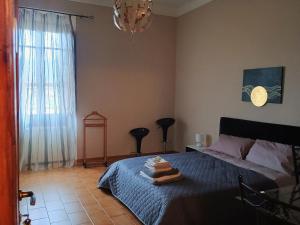 Postel nebo postele na pokoji v ubytování La Divina guest house