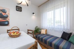 Postel nebo postele na pokoji v ubytování Apartments Kate