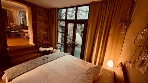 a bedroom with a bed and a large window at Apartment am Schloss - FLAIR in Saarbrücken