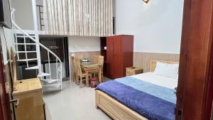 Ένα ή περισσότερα κρεβάτια σε δωμάτιο στο Khách sạn Thái sơn Phú Quốc