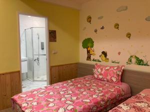 Postel nebo postele na pokoji v ubytování 安可的家 小孩及寵物免費 恆春老街夜市 屏東縣民宿0497