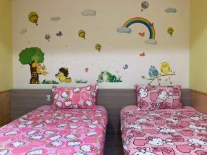 Postel nebo postele na pokoji v ubytování 安可的家 小孩及寵物免費 恆春老街夜市 屏東縣民宿0497