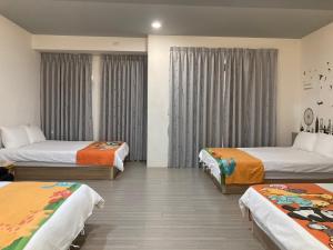 Postel nebo postele na pokoji v ubytování 安可的家 小孩及寵物免費 恆春老街夜市 屏東縣民宿0497