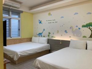 Postel nebo postele na pokoji v ubytování 安可的家 小孩及寵物免費 恆春老街夜市 屏東縣民宿0497