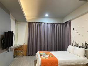 Postel nebo postele na pokoji v ubytování 安可的家 小孩及寵物免費 恆春老街夜市 屏東縣民宿0497