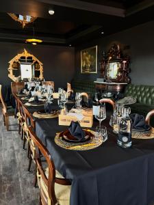 a long table with a blue table cloth and chairs at ZEN & ART - Alojamento de Charme in Santa Maria da Feira