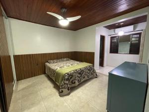 Postel nebo postele na pokoji v ubytování Casa de Luxo no Itaguá. A 5 minutos das principais Praias (Praia Grande, Tenorio, Vermelha do Centro e Toninhas)