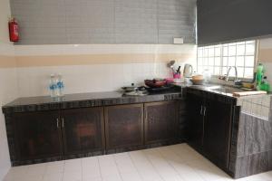 Η κουζίνα ή μικρή κουζίνα στο 马六甲老地方3房住宿 +6 φωτογραφίες