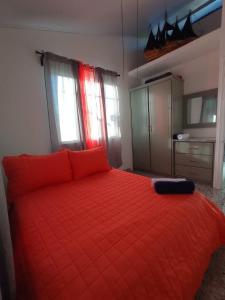 Giường trong phòng chung tại Casa Cocles