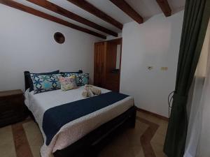Ένα ή περισσότερα κρεβάτια σε δωμάτιο στο Mar y Luz Casita Hotel
