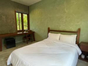 Postel nebo postele na pokoji v ubytování COCO HOME Homestay(โคโค่โฮม)