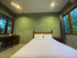 Postel nebo postele na pokoji v ubytování COCO HOME Homestay(โคโค่โฮม)
