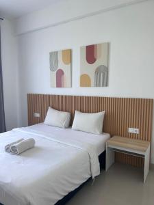 Postel nebo postele na pokoji v ubytování Olivia SOHO Guest House