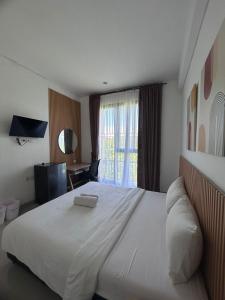Postel nebo postele na pokoji v ubytování Olivia SOHO Guest House