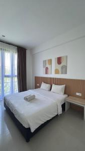 Postel nebo postele na pokoji v ubytování Olivia SOHO Guest House