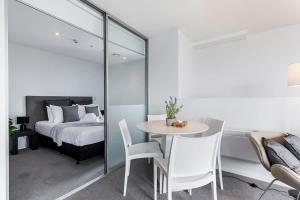 A bed or beds in a room at Sky Tower View 2BR Apt w Gym & Pool Access