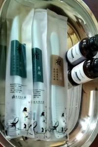 a group of four bottles of mascara in a jar at Dreamer Resort in San Vicente