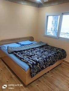 Postel nebo postele na pokoji v ubytování Devalsari Homestay